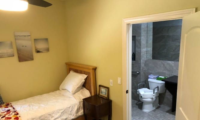 Private resident room with a bed and bathroom