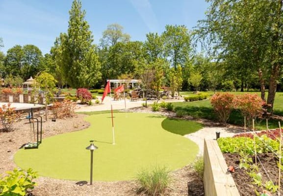 Lush garden with mini-golf area and seating