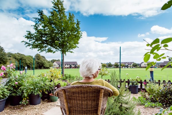 Resident enjoying the outdoor garden space