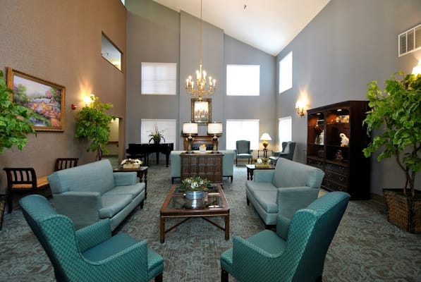 Spacious lobby area with seating and piano