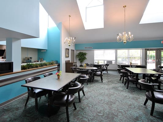 Bright and spacious dining area with tables and chairs
