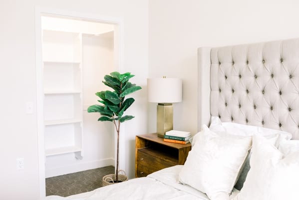Brightly lit private resident room with bed and decor