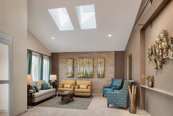 Welcoming lounge area with comfortable seating and artwork