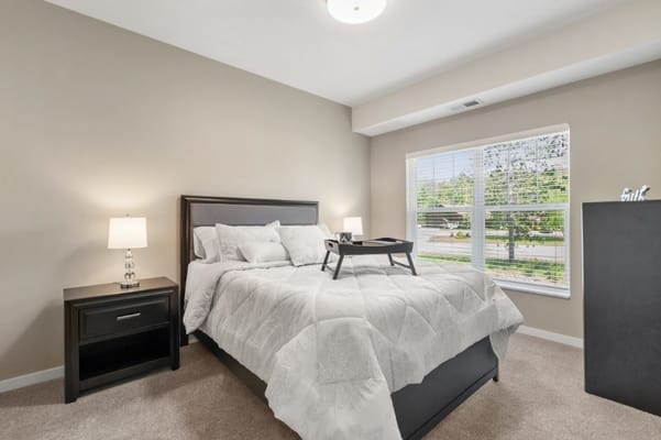 Cozy private resident room with a bed and desk