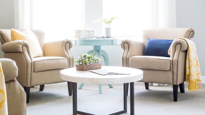 Warm and inviting living room with two armchairs and a coffee table