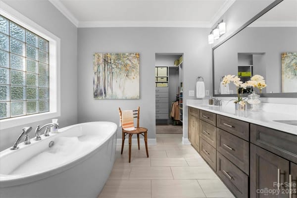 Spacious bathroom featuring a freestanding bathtub and modern fixtures
