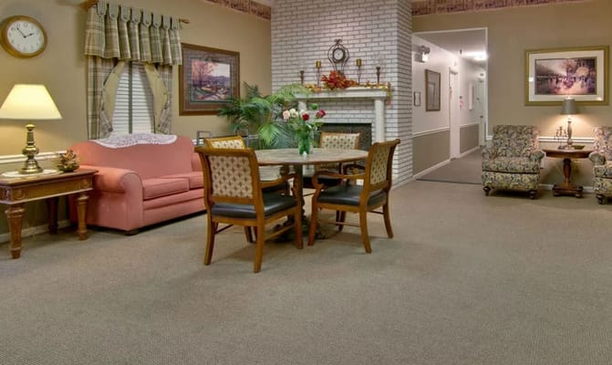 Bright common area with sofas and a dining table