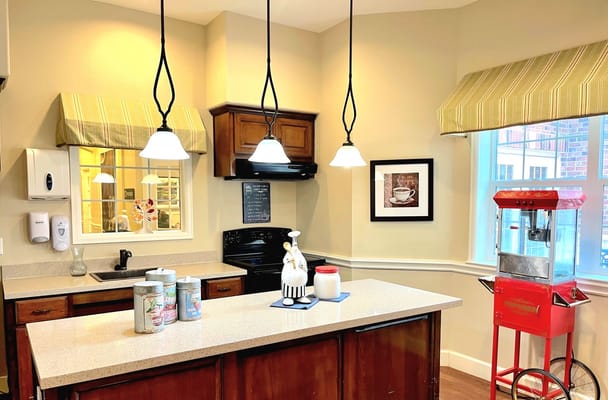 Bright kitchen with wooden cabinets and a popcorn machine