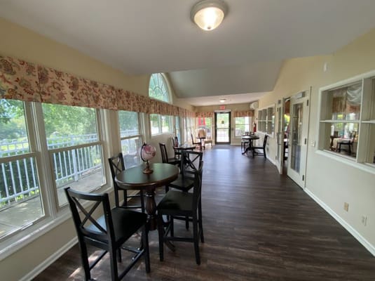 Bright common area with seating and large windows