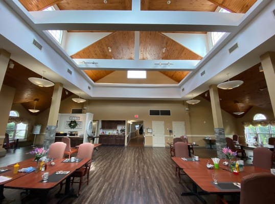 Bright and spacious dining room area with tables and decor