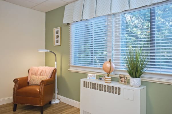 Cozy resident room with a chair and window light
