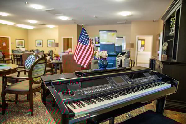 Interior common area with a piano and American flag