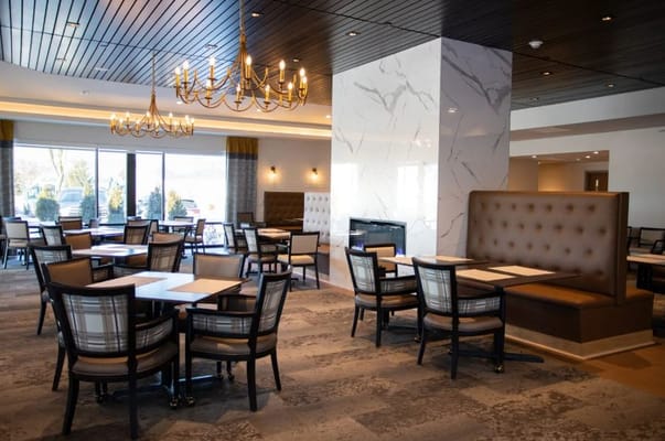 Modern dining room with stylish furniture and lighting