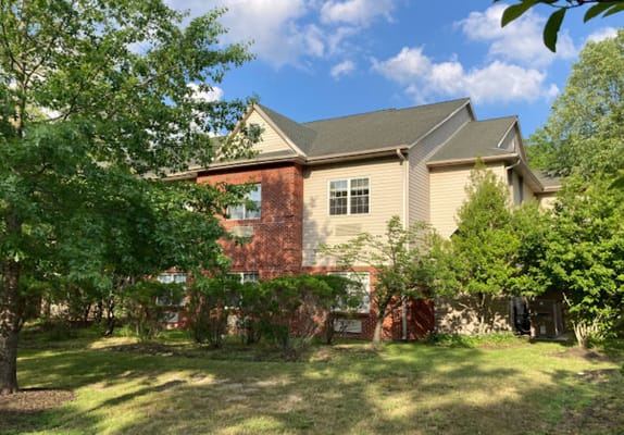 Exterior view of Woodview Estates with greenery