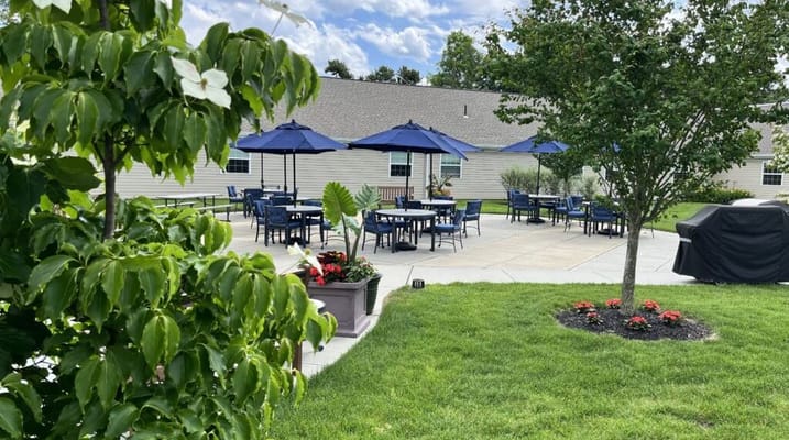 Outdoor patio area with tables and umbrellas