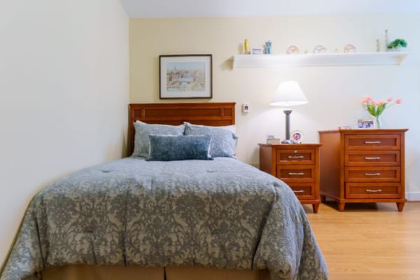Cozy private room with a bed and bedside tables