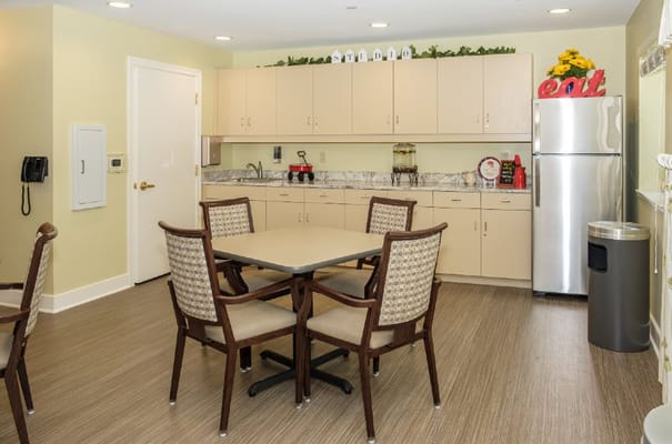 Bright common area with kitchen and seating