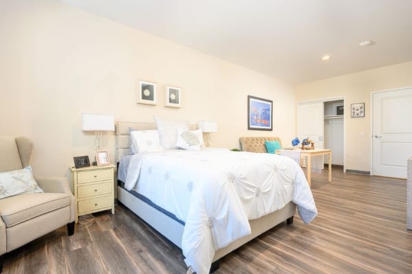 Cozy private resident room with a bed and furnishings