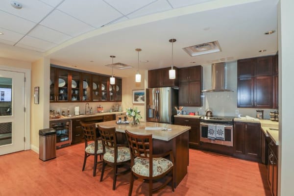 Modern kitchen with wooden cabinets and dining area