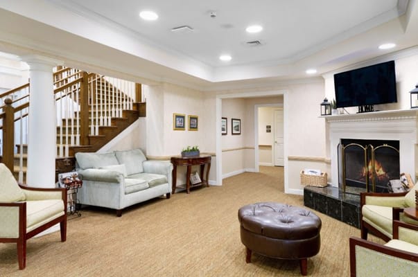 Cozy interior common area with seating and fireplace