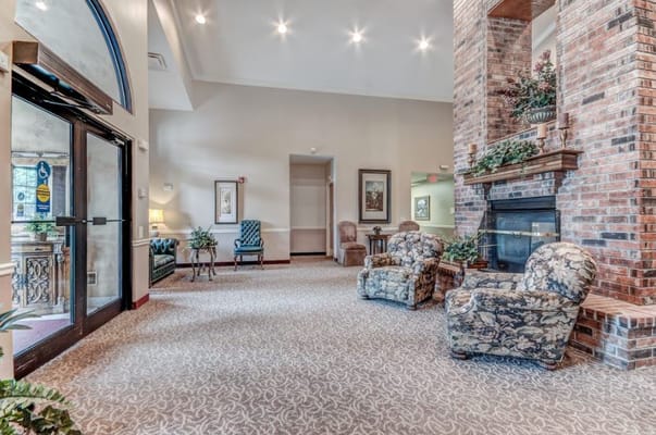 Spacious lobby with seating and fireplace at The Bungalows at Chesterfield Village