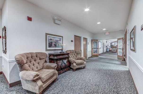 Hallway with plush seating and decorative elements