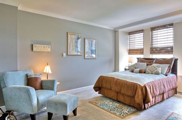 Cozy private resident room with bed and seating area