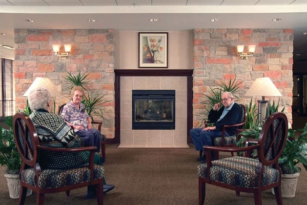 Residents chatting in a cozy common area