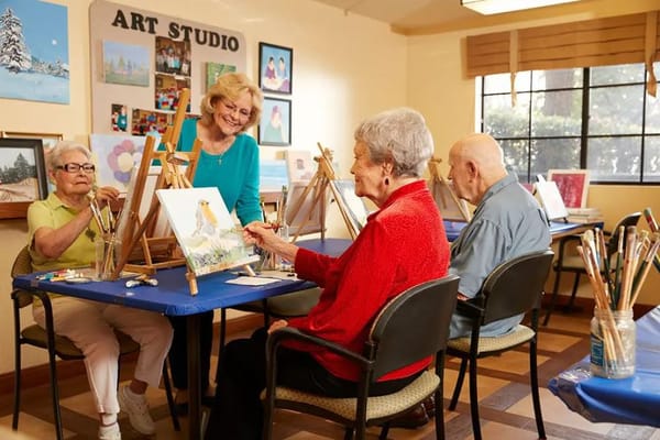 Residents painting in an art studio activity