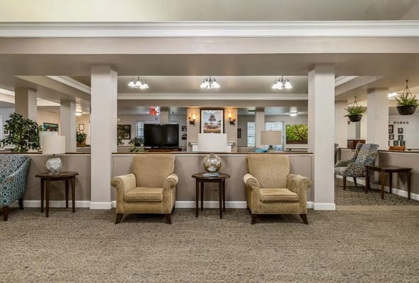 Lounge area with two armchairs and side tables in Cypress Square