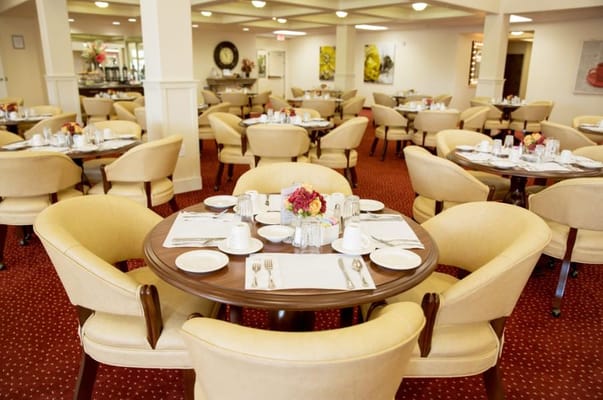 Elegant dining room with round tables and floral centerpieces