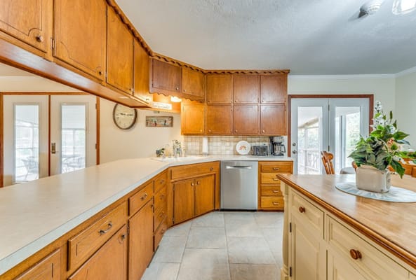 Bright kitchen area with wooden cabinets
