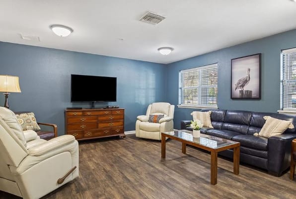 Comfortable living room with seating and television