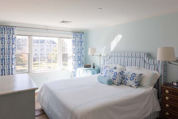 Bright bedroom in assisted living facility with blue decor