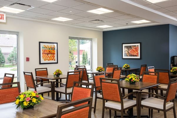 Bright dining room with flowers on tables