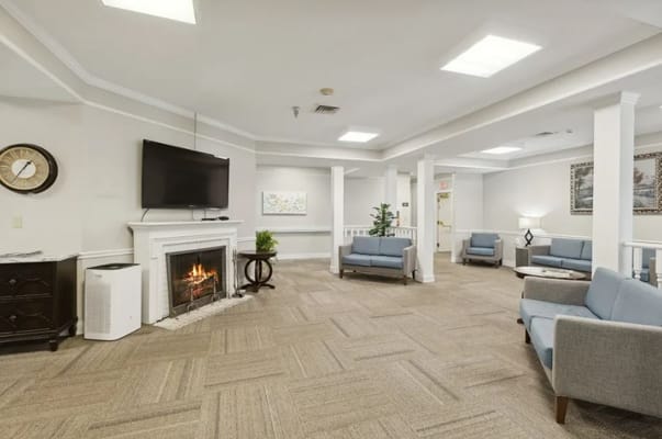 Cozy living room with a fireplace and seating area