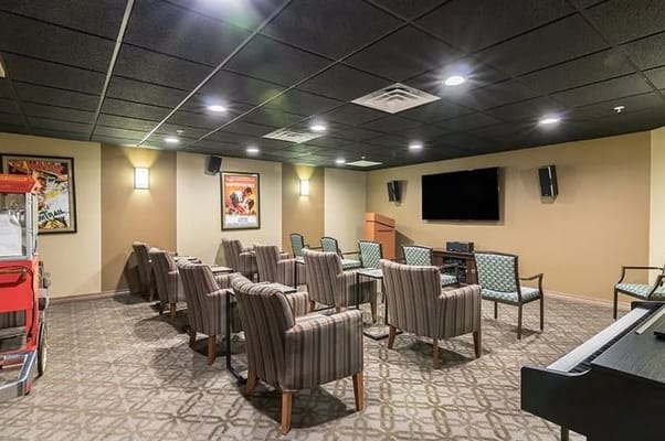 Interior common area with seating and a projector
