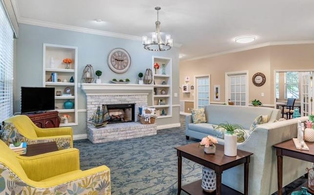 Spacious living room with comfortable seating and a fireplace