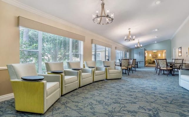 Bright living room with comfortable seating and dining area.