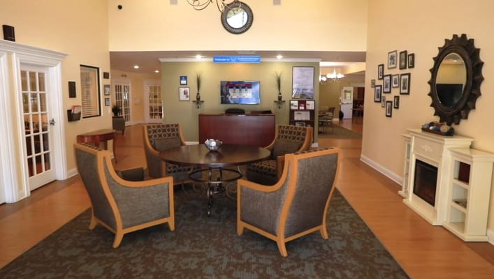 Lobby seating area with circular table and decorative elements