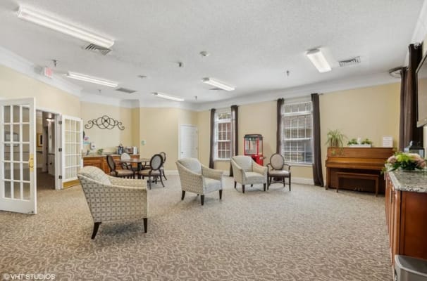 Spacious common area with seating and a piano