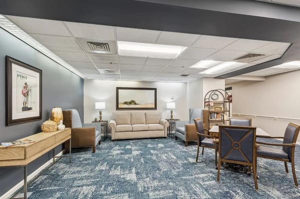 Cozy lounge area with seating and a decorative table.