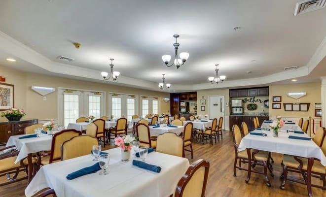 Dining room set with tables and chairs at The Legacy of Camden