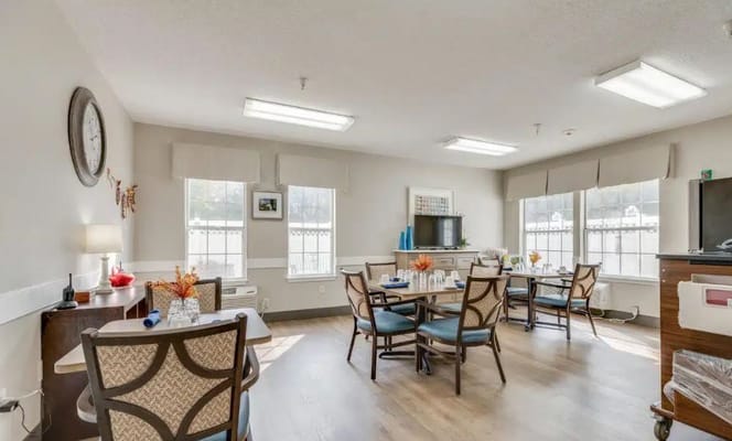 Interior view of a common area with tables and chairs