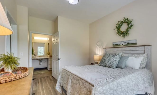 Well-furnished bedroom with a bed and attached bathroom