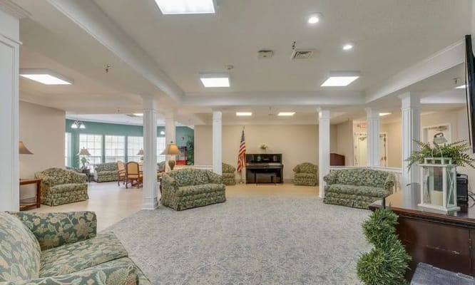 Cozy lounge area with seating and a piano