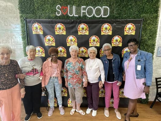 Residents enjoying a social event in an activity room