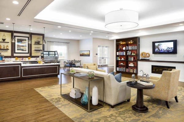 Bright common area with dining space and seating