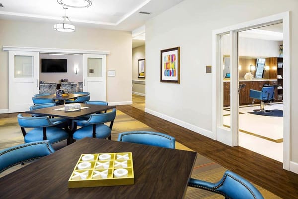 Common area with seating and a view into a salon