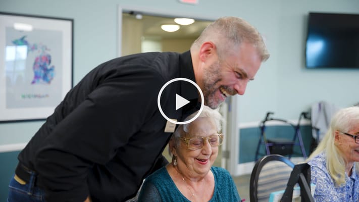 Staff member engaging with resident in a common area